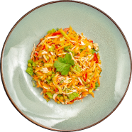 A vibrant and healthy quinoa salad from Voro Food, featuring a colorful medley of fresh vegetables and herbs on a modern ceramic plate.